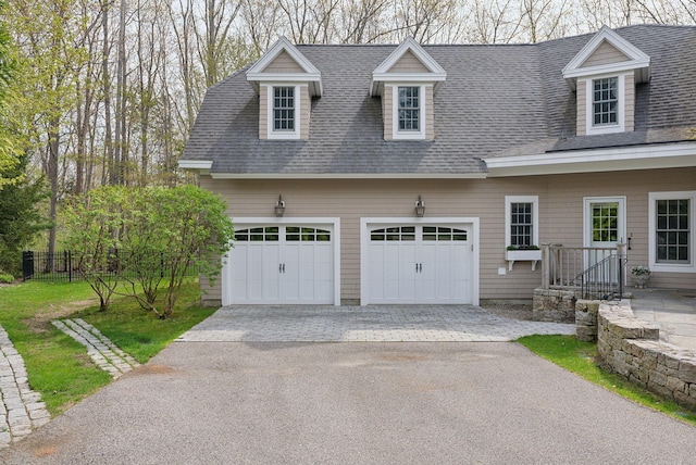 11 Clubhouse Dr, Kennebunk, ME 04043 - view of front facade with driveway, a shingled roof, fence, and an attached garage