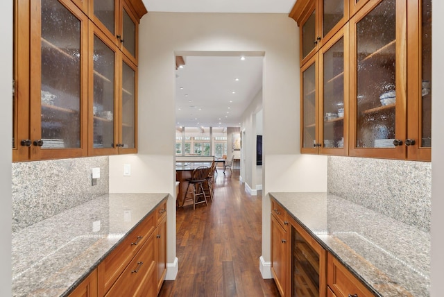 11 Clubhouse Dr, Kennebunk, ME 04043 - bar featuring wine cooler, dark wood-style flooring, decorative backsplash, recessed lighting, and baseboards