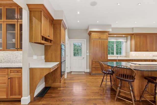 11 Clubhouse Dr, Kennebunk, ME 04043 - kitchen featuring a kitchen bar, wood finished floors, healthy amount of natural light, and recessed lighting