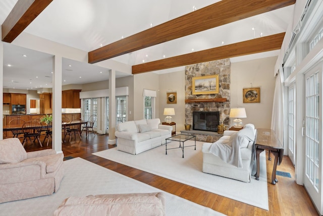11 Clubhouse Dr, Kennebunk, ME 04043 - living area featuring wood finished floors, a stone fireplace, beamed ceiling, and recessed lighting