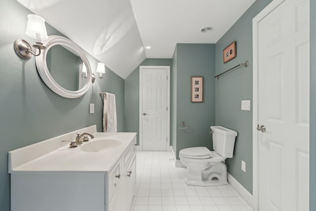 11 Clubhouse Dr, Kennebunk, ME 04043 - bathroom featuring tile patterned floors, toilet, baseboards, vanity, and lofted ceiling