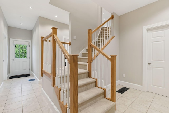 11 Clubhouse Dr, Kennebunk, ME 04043 - entryway featuring light tile patterned floors, stairs, baseboards, and recessed lighting