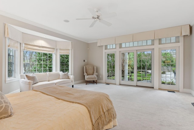11 Clubhouse Dr, Kennebunk, ME 04043 - carpeted bedroom featuring access to outside, baseboards, multiple windows, ornamental molding, and ceiling fan