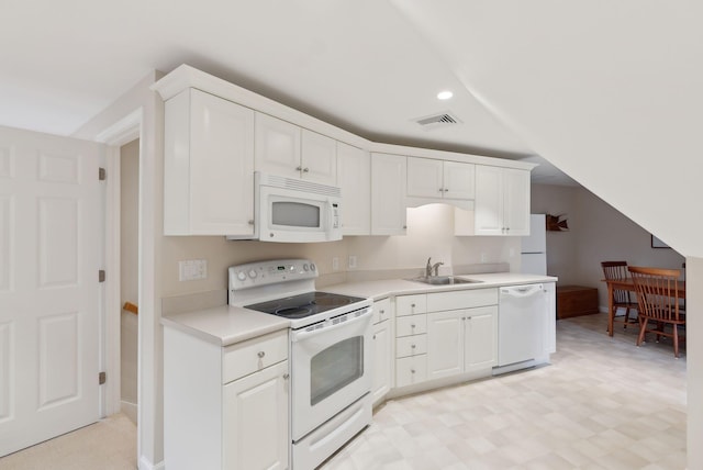 11 Clubhouse Dr, Kennebunk, ME 04043 - kitchen featuring white appliances, light countertops, white cabinetry, recessed lighting, and a sink