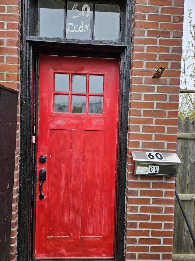 58 Cedar St, Bangor, ME 04401 - doorway to property with brick siding