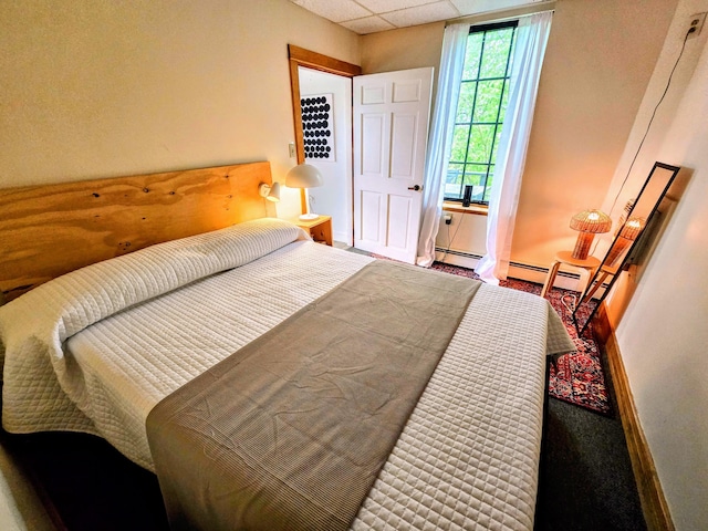 58 Cedar St, Bangor, ME 04401 - bedroom featuring baseboards, a paneled ceiling, carpet floors, and baseboard heating