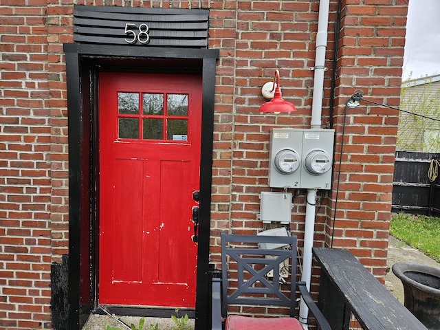 58 Cedar St, Bangor, ME 04401 - property entrance featuring brick siding