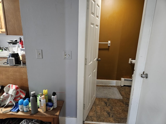 58 Cedar St, Bangor, ME 04401 - corridor featuring a baseboard radiator, stone finish floors, and baseboards