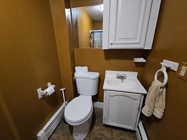 58 Cedar St, Bangor, ME 04401 - bathroom with a baseboard radiator, toilet, vanity, tile patterned floors, and baseboards