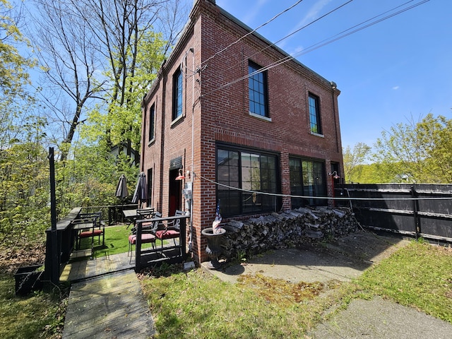 58 Cedar St, Bangor, ME 04401 - view of side of home with brick siding