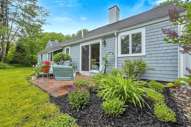 4 Oakview Dr Unit 4, Cape Elizabeth, ME 04107 - rear view of house with a patio, a yard, a chimney, and roof with shingles