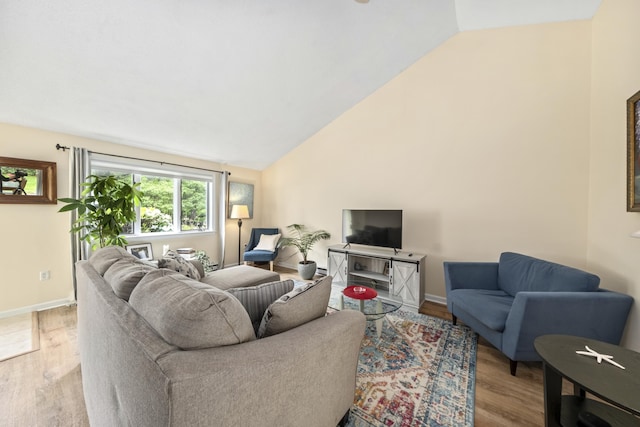 4 Oakview Dr Unit 4, Cape Elizabeth, ME 04107 - living room with vaulted ceiling, wood finished floors, and baseboards