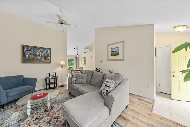 4 Oakview Dr Unit 4, Cape Elizabeth, ME 04107 - living room with lofted ceiling, light wood finished floors, a ceiling fan, a wall mounted air conditioner, and baseboards
