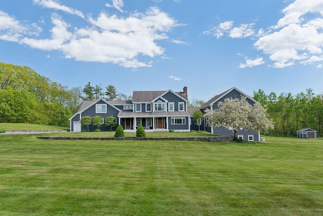 10 Jameson Dr, Falmouth, ME 04105 - view of front of property featuring a porch, a chimney, and a front lawn