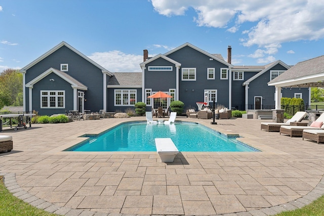 10 Jameson Dr, Falmouth, ME 04105 - swimming pool featuring a patio area, a diving board, and an outdoor living space