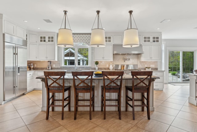 10 Jameson Dr, Falmouth, ME 04105 - kitchen with built in fridge, a kitchen island, white cabinets, and recessed lighting