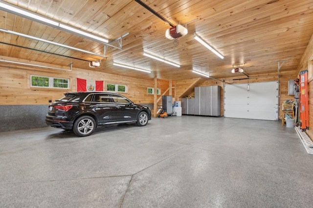 10 Jameson Dr, Falmouth, ME 04105 - garage with a garage door opener and wood walls