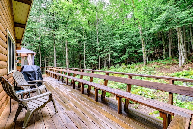 134 Valhalla Ln, Norway, ME 04268 - deck with a wooded view and grilling area
