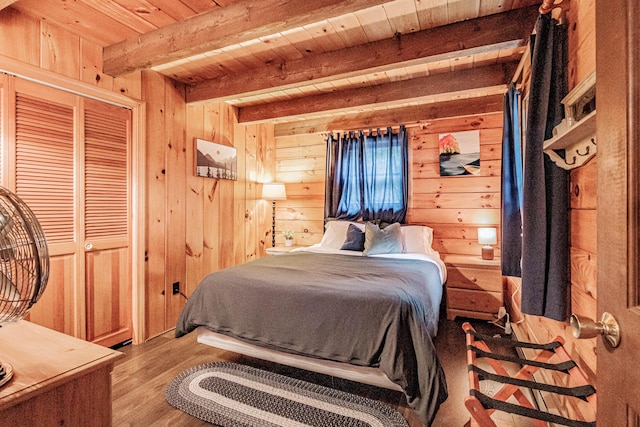 134 Valhalla Ln, Norway, ME 04268 - bedroom with wood ceiling with exposed beams, wood walls, and wood finished floors