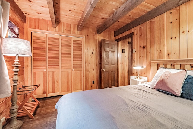 134 Valhalla Ln, Norway, ME 04268 - bedroom featuring wooden walls, wood finished floors, wooden ceiling with exposed beams, and a closet