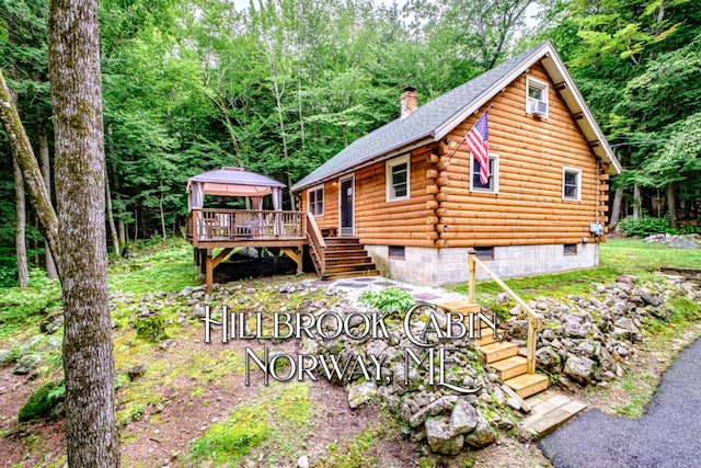 134 Valhalla Ln, Norway, ME 04268 - view of front of property with a gazebo, log siding, a chimney, stairs, and a deck