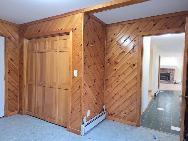 20 Brandywine Cir, Auburn, ME 04210 - hall featuring a baseboard radiator, light tile patterned floors, wood walls, and baseboards