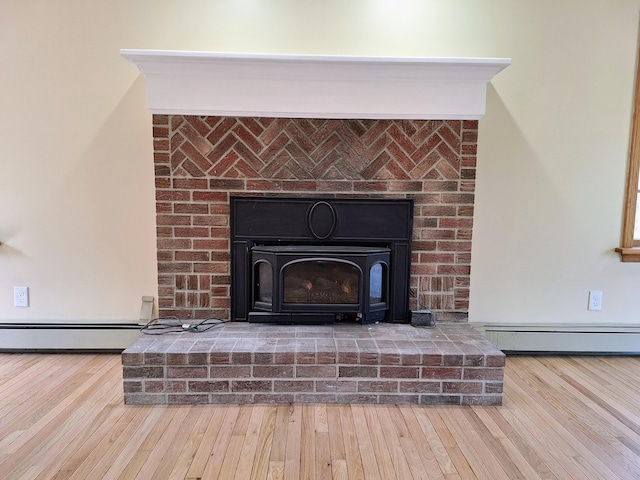 20 Brandywine Cir, Auburn, ME 04210 - detailed view of a baseboard radiator, wood finished floors, and a fireplace