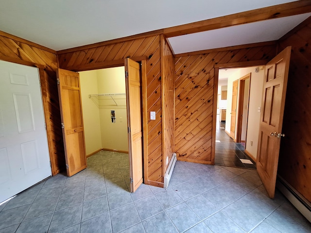 20 Brandywine Cir, Auburn, ME 04210 - hallway with baseboard heating, wood walls, light tile patterned floors, baseboards, and beamed ceiling