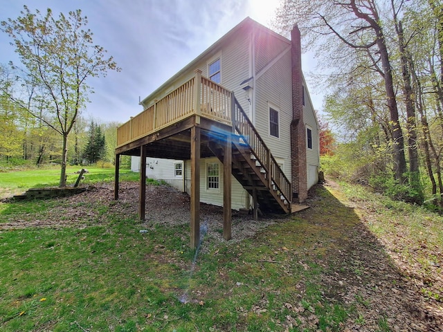 20 Brandywine Cir, Auburn, ME 04210 - back of property with a wooden deck, stairs, and a chimney