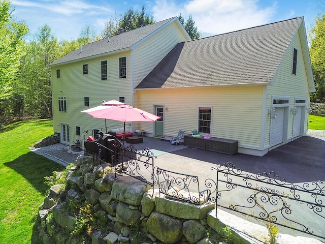 22 Lindas Way, Manchester, ME 04351 - back of house featuring a yard, roof with shingles, and a patio