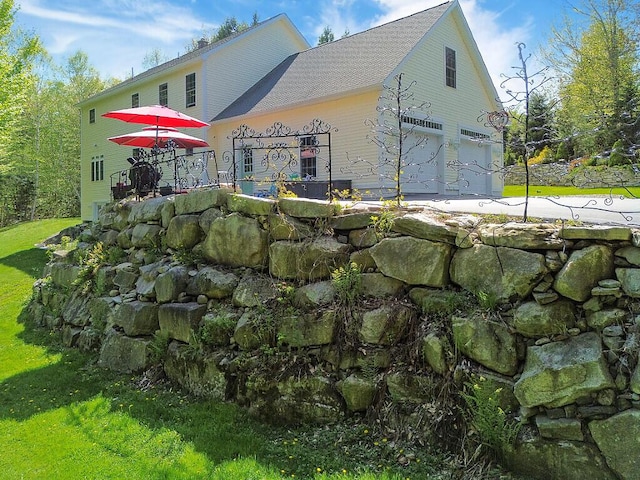 22 Lindas Way, Manchester, ME 04351 - view of side of home with roof with shingles, a deck, and a lawn