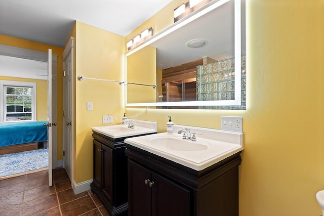 22 Lindas Way, Manchester, ME 04351 - bathroom featuring two vanities, baseboards, and tile patterned floors