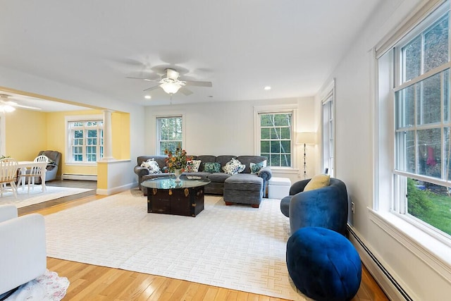 22 Lindas Way, Manchester, ME 04351 - living room featuring baseboard heating, wood finished floors, ceiling fan, and recessed lighting
