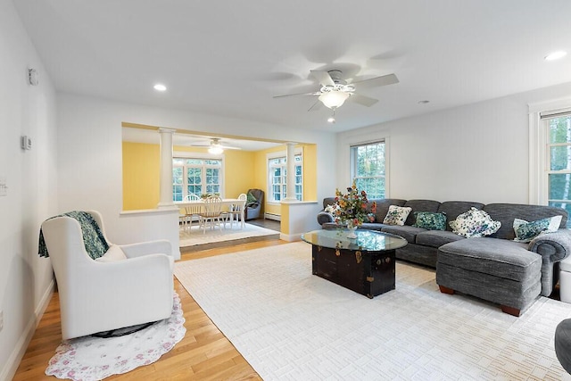 22 Lindas Way, Manchester, ME 04351 - living room featuring ornate columns, wood finished floors, healthy amount of natural light, ceiling fan, and recessed lighting