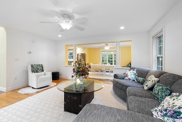 22 Lindas Way, Manchester, ME 04351 - living room with ornate columns, ceiling fan, wood finished floors, recessed lighting, and baseboards
