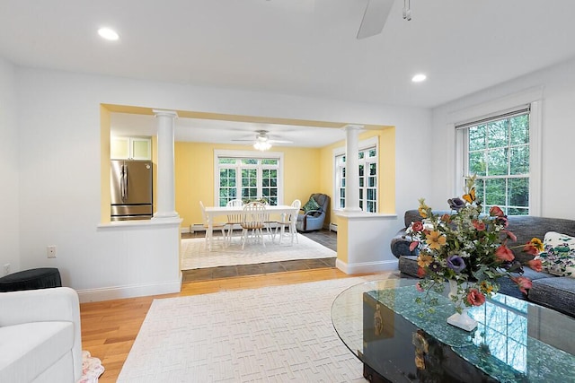 22 Lindas Way, Manchester, ME 04351 - living room featuring ceiling fan, decorative columns, light wood-style floors, baseboards, and recessed lighting