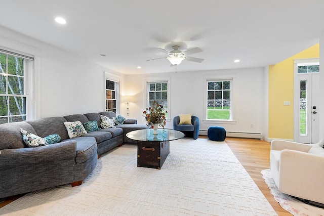 22 Lindas Way, Manchester, ME 04351 - living area with a baseboard radiator, plenty of natural light, light wood finished floors, and recessed lighting