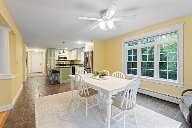22 Lindas Way, Manchester, ME 04351 - dining area with baseboard heating, tile patterned flooring, baseboards, ornate columns, and a ceiling fan