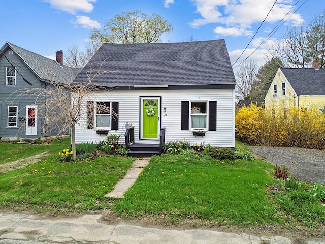 66 Beechwood St, Thomaston, ME 04861 - bungalow-style house featuring roof with shingles, a front lawn, and a chimney