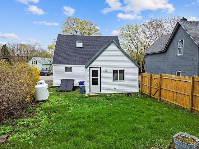 66 Beechwood St, Thomaston, ME 04861 - rear view of property featuring a shingled roof