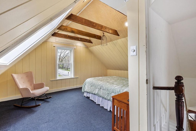66 Beechwood St, Thomaston, ME 04861 - bedroom with vaulted ceiling, carpet, wood walls, and a skylight