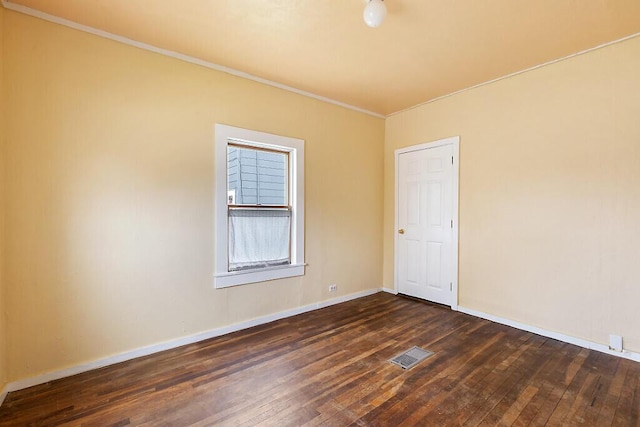 66 Beechwood St, Thomaston, ME 04861 - empty room with dark wood-style floors, crown molding, and baseboards