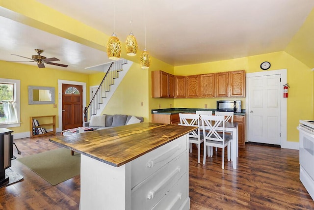 66 Beechwood St, Thomaston, ME 04861 - kitchen with butcher block counters, dark wood finished floors, ceiling fan, brown cabinetry, and black microwave