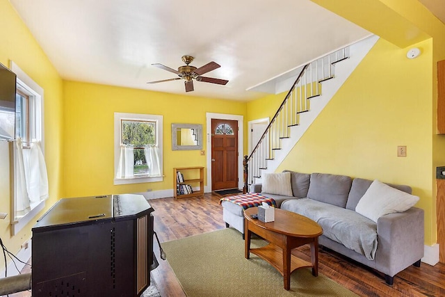 66 Beechwood St, Thomaston, ME 04861 - living area featuring stairway, ceiling fan, wood finished floors, and baseboards