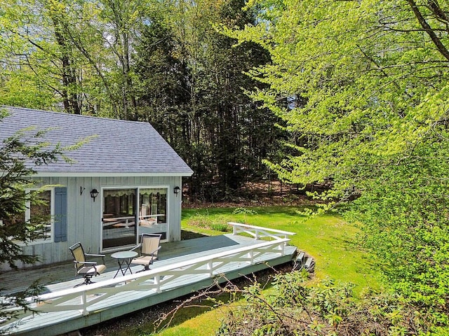 66 Brickett Point Ests, Oakland, ME 04963 - view of yard with a deck and an outdoor structure