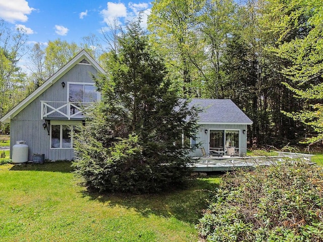 66 Brickett Point Ests, Oakland, ME 04963 - rear view of house with a deck, a yard, and central air condition unit