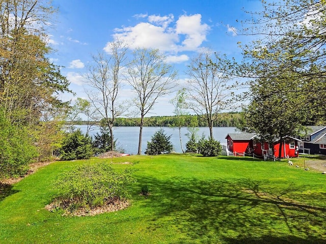 66 Brickett Point Ests, Oakland, ME 04963 - view of green lawn featuring a water view and an outdoor structure