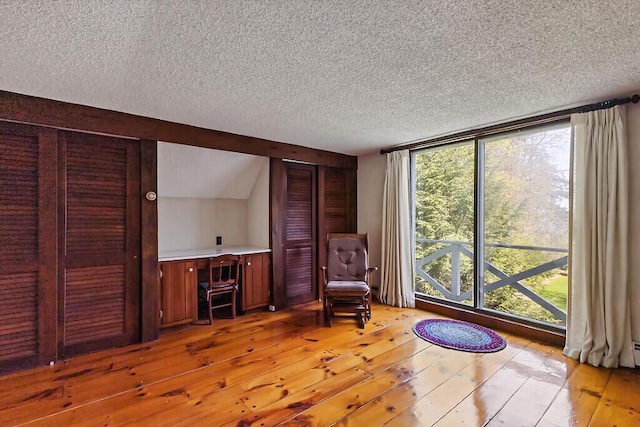 66 Brickett Point Ests, Oakland, ME 04963 - living area featuring hardwood / wood-style flooring and a textured ceiling