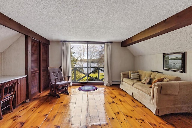 66 Brickett Point Ests, Oakland, ME 04963 - living room featuring a textured ceiling, light wood-style floors, and a water view