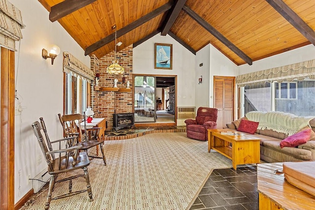 66 Brickett Point Ests, Oakland, ME 04963 - living area with a wood stove, wooden ceiling, beam ceiling, and high vaulted ceiling